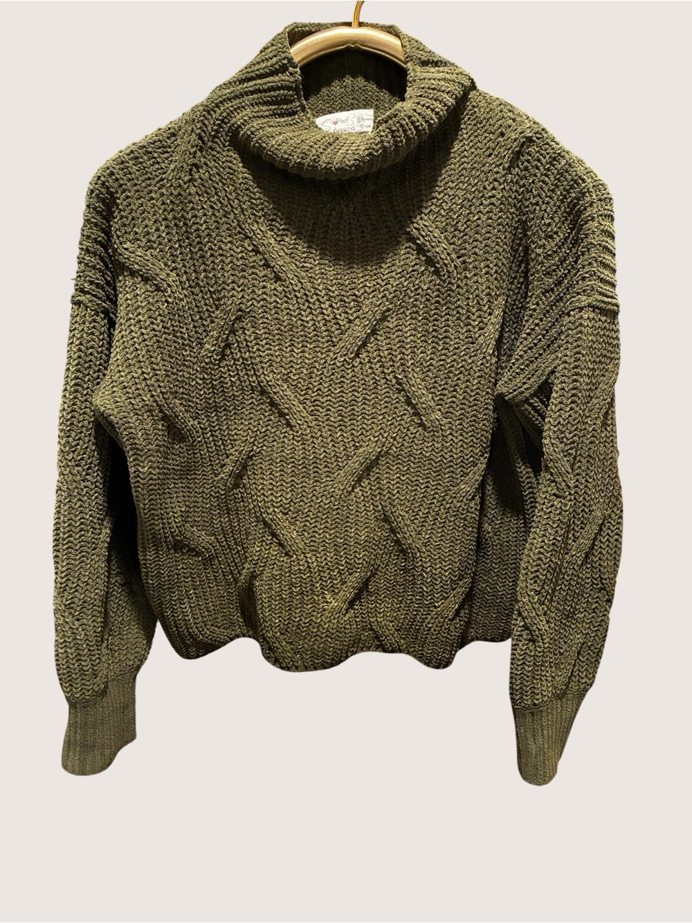Poof! Olive Green Chunky knit texture and a cropped silhouette.